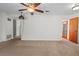 View of the open-concept room with neutral carpeting and light colored walls at 1807 Yorkshire Dr, Winter Park, FL 32792