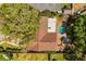Aerial view of a home with a pool, well-maintained landscaping, and a spacious backyard at 2508 Osage Trl, Fern Park, FL 32730