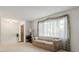 Inviting living room with neutral carpet, bright window, and comfortable seating at 2508 Osage Trl, Fern Park, FL 32730