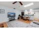 Living room showcasing hardwood floors, a ceiling fan, comfortable seating, and natural light at 2508 Osage Trl, Fern Park, FL 32730