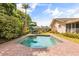Inviting in-ground pool with stamped concrete deck and lush landscaping at 2508 Osage Trl, Fern Park, FL 32730