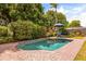 Inviting backyard pool with a brick patio and lush landscaping, perfect for relaxation and entertainment at 2508 Osage Trl, Fern Park, FL 32730