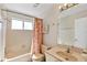 Bright bathroom with a tub and shower combination and a large vanity mirror at 2568 Woodgate Blvd # 204, Orlando, FL 32822