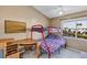 Cozy bedroom features a bunk bed, desk, and a serene view of the canal at 2568 Woodgate Blvd # 204, Orlando, FL 32822