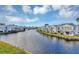 Beautiful waterfront community featuring a canal with fountain, blue skies, and well-manicured lawns at 2568 Woodgate Blvd # 204, Orlando, FL 32822