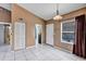 Inviting dining area with tiled floors, a light fixture, and a window at 2568 Woodgate Blvd # 204, Orlando, FL 32822