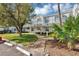 Charming exterior of the condos with well-manicured lawn at 2568 Woodgate Blvd # 204, Orlando, FL 32822