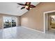 Bright living room featuring tiled floors and a sliding door to the outdoor view at 2568 Woodgate Blvd # 204, Orlando, FL 32822