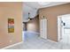 Spacious living area with tiled floors, neutral walls, and modern ceiling fan at 2568 Woodgate Blvd # 204, Orlando, FL 32822