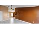 Open living area with tile floors, contrasting walls, and abundant natural light at 2568 Woodgate Blvd # 204, Orlando, FL 32822