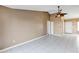 Spacious living room with tiled floors and neutral color scheme, ready for personalization at 2568 Woodgate Blvd # 204, Orlando, FL 32822