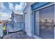 Relaxing patio with a table, offering views of the surrounding community at 2568 Woodgate Blvd # 204, Orlando, FL 32822