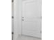 A simple, classic white interior door with silver hardware at 307 Corsica Ct, Kissimmee, FL 34758