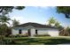 Charming single-story home with a well-manicured lawn and a two-car garage at 307 Corsica Ct, Kissimmee, FL 34758