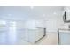 Spacious living room with an island kitchen, a sink, stainless steel appliances, and sliding glass doors to the backyard at 307 Corsica Ct, Kissimmee, FL 34758