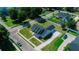 Aerial view highlighting the home's roof, driveway, and the neat landscaping in a suburban setting at 311 W Delaware Ave, Lake Helen, FL 32744