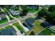 Aerial view of a well-kept, light blue single Gathering home with attached garage and long driveway at 311 W Delaware Ave, Lake Helen, FL 32744