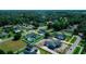 Aerial view captures suburban homes with pools and lush greenery, nestled in a serene neighborhood at 311 W Delaware Ave, Lake Helen, FL 32744