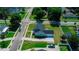 Aerial view of a well-kept, light blue single Gathering home with attached garage and long driveway at 311 W Delaware Ave, Lake Helen, FL 32744