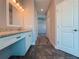 Bathroom vanity area with granite countertop, recessed lighting, and tiled floor, creating a comfortable space at 311 W Delaware Ave, Lake Helen, FL 32744