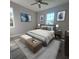Beautiful bedroom with bed, two windows, overhead fan and blue-themed decor at 311 W Delaware Ave, Lake Helen, FL 32744