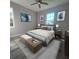 Serene bedroom with blue accents, soft lighting, and stylish furnishings for a comfortable retreat at 311 W Delaware Ave, Lake Helen, FL 32744