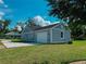 Lovely house showing attached garage, and well-kept lawn, offering both curb appeal and functionality at 311 W Delaware Ave, Lake Helen, FL 32744