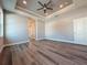 Spacious main bedroom with tray ceiling, recessed lighting, and a walk-in closet for ample storage at 311 W Delaware Ave, Lake Helen, FL 32744