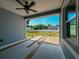 View from inside the covered porch with view of the wooden deck at 311 W Delaware Ave, Lake Helen, FL 32744