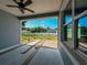 A back porch view from inside shows the new wooden deck construction at 311 W Delaware Ave, Lake Helen, FL 32744