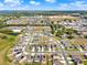 Expansive aerial view of a residential community with modern homes, manicured lawns, and convenient access to nearby amenities at 312 Inman Blvd, Winter Haven, FL 33881