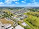 Birds-eye view of a housing development featuring a mix of architectural styles, lush landscaping, and surrounding natural beauty at 312 Inman Blvd, Winter Haven, FL 33881