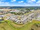 High-angle view of a well-planned neighborhood, showcasing its organized layout, green spaces, and proximity to urban areas at 312 Inman Blvd, Winter Haven, FL 33881