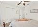 Cozy bedroom featuring a ceiling fan and a spacious closet at 312 Inman Blvd, Winter Haven, FL 33881