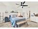 Comfortable bedroom with neutral tones, ceiling fan, and connected bathroom at 312 Inman Blvd, Winter Haven, FL 33881