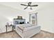 Relaxing bedroom with soft colors, ceiling fan and a comfortable queen bed at 312 Inman Blvd, Winter Haven, FL 33881