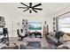 Charming living room with modern furnishings, a ceiling fan, and decor accents at 312 Inman Blvd, Winter Haven, FL 33881