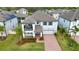 Aerial view of a two-story home showcasing its architectural details and surrounding neighborhood at 3121 Buffington Pl, Oviedo, FL 32765
