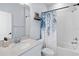 Clean bathroom with a white vanity, a decorative mirror, and a shower-tub combination at 3121 Buffington Pl, Oviedo, FL 32765