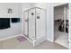Modern bathroom with a glass-enclosed shower and walk-in closet at 3121 Buffington Pl, Oviedo, FL 32765