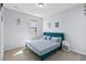 Comfortable bedroom with a blue upholstered headboard, side tables, and soft neutral carpet at 3121 Buffington Pl, Oviedo, FL 32765