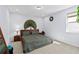 Comfortable bedroom featuring a queen-sized bed and neutral color palette at 3121 Buffington Pl, Oviedo, FL 32765