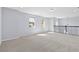 Spacious bonus room featuring neutral walls, plush carpeting, and multiple windows allowing ample natural light at 3121 Buffington Pl, Oviedo, FL 32765