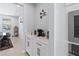 Stylish coffee bar area with white cabinets and modern appliances, perfect for entertaining at 3121 Buffington Pl, Oviedo, FL 32765