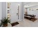 Welcoming entryway with tile floors, plant, and view into the dining room with large table at 3121 Buffington Pl, Oviedo, FL 32765