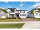 Elegant two-story home with manicured lawn and inviting front entrance at 3121 Buffington Pl, Oviedo, FL 32765