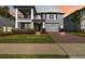 Beautiful two-story home with manicured lawn, paver driveway, and inviting curb appeal at 3121 Buffington Pl, Oviedo, FL 32765