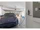Clean garage featuring a blue car, white walls, and an electric car charger on the side at 3121 Buffington Pl, Oviedo, FL 32765