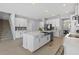 A well-appointed kitchen featuring white cabinetry, stainless appliances, and an island with a sink at 3121 Buffington Pl, Oviedo, FL 32765