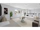 Bright living room with plush white sofa, stylish marble table, and modern decor accents at 3121 Buffington Pl, Oviedo, FL 32765